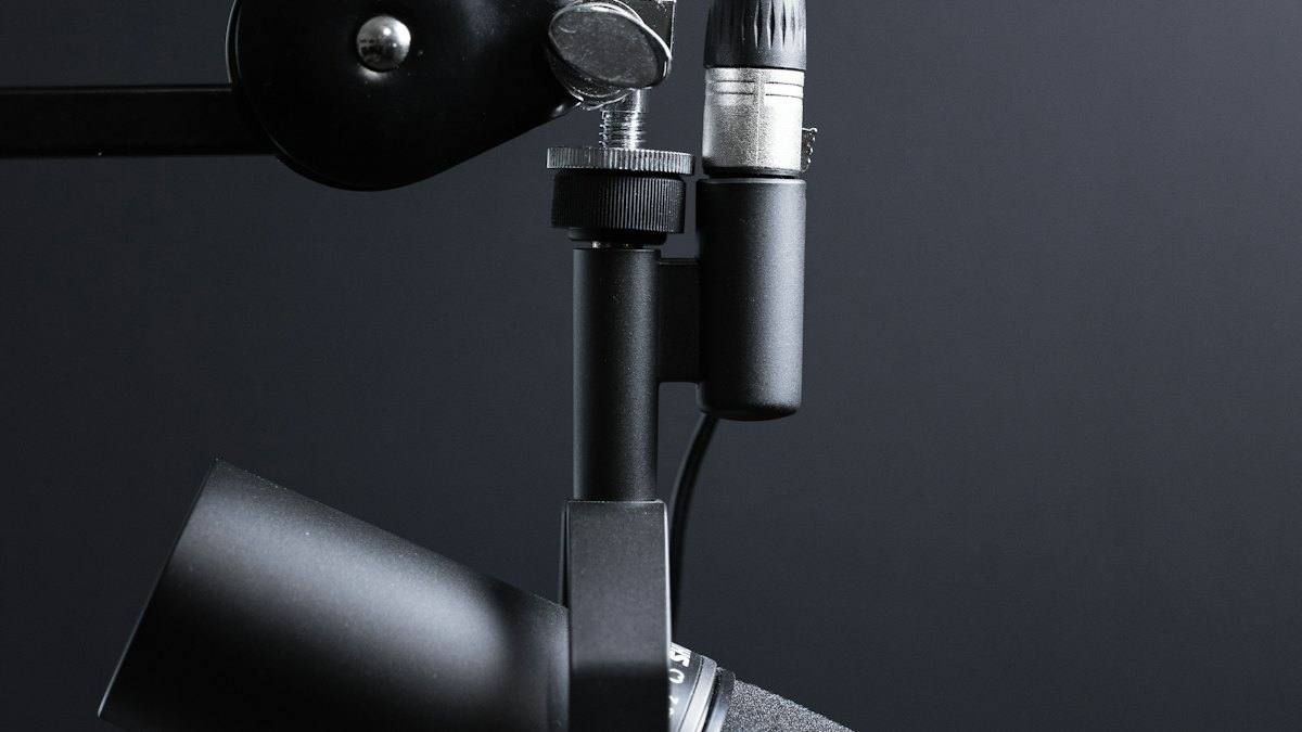 Microphone on a boom arm in a home recording setup